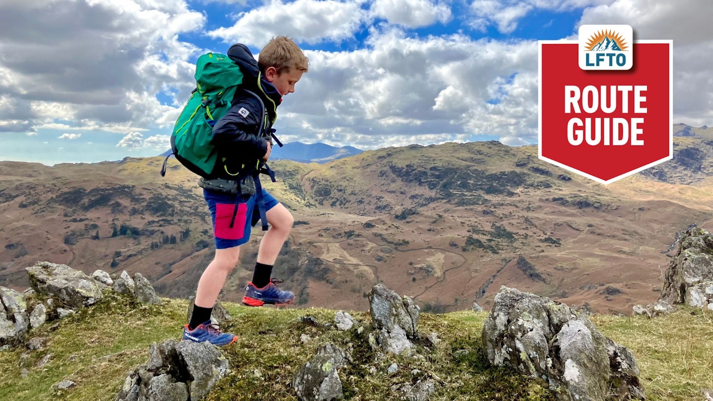 child hiking in the mountains