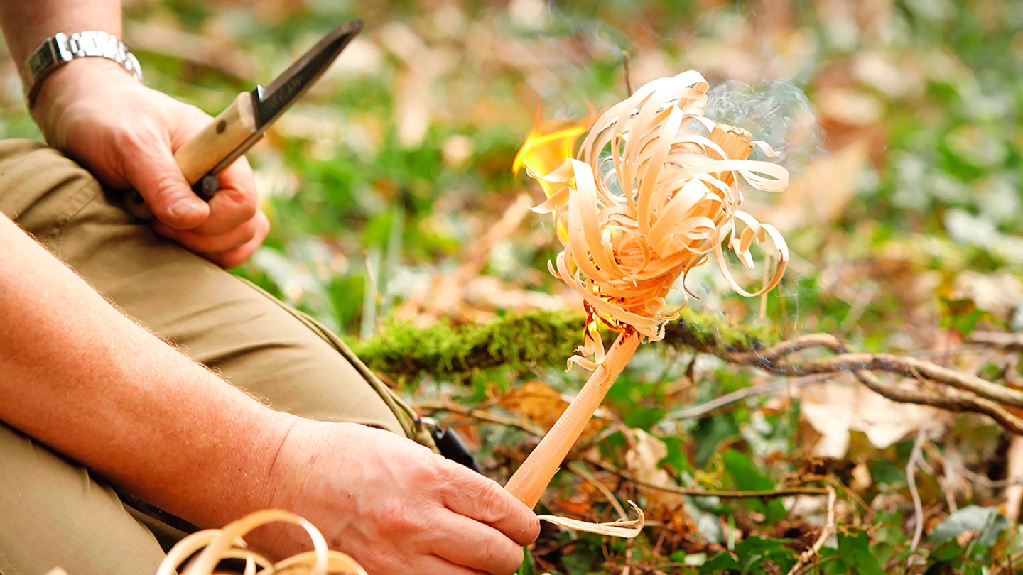 building a fire while wild camping