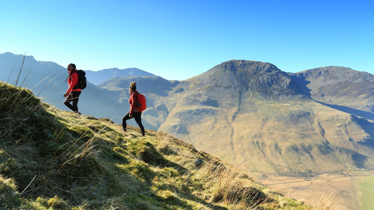 Two women walking up Fleetwith Pike in the Lake District