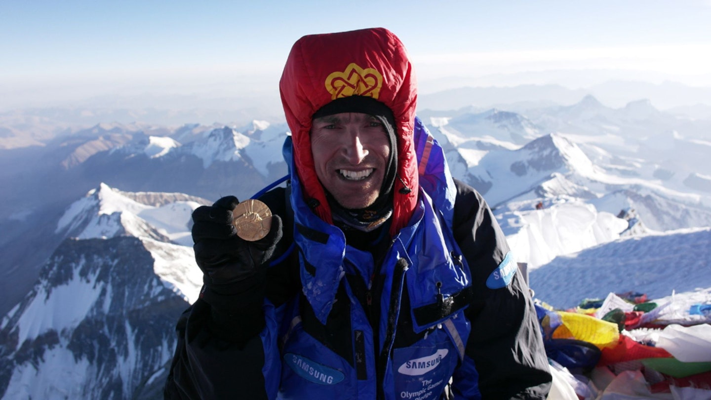 Kenton Cool on Everest holding a medal