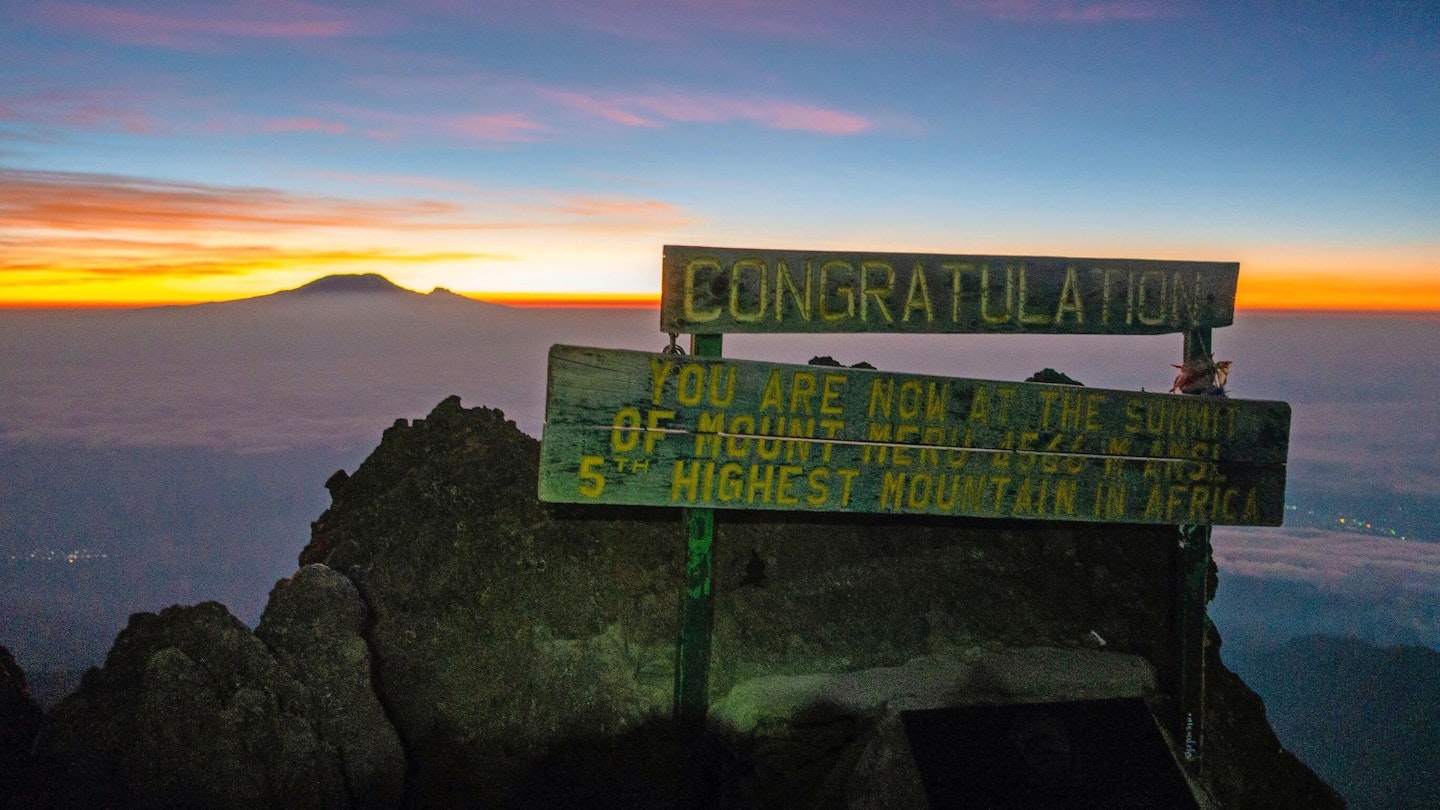 The summit sign at the top of Mount Meru