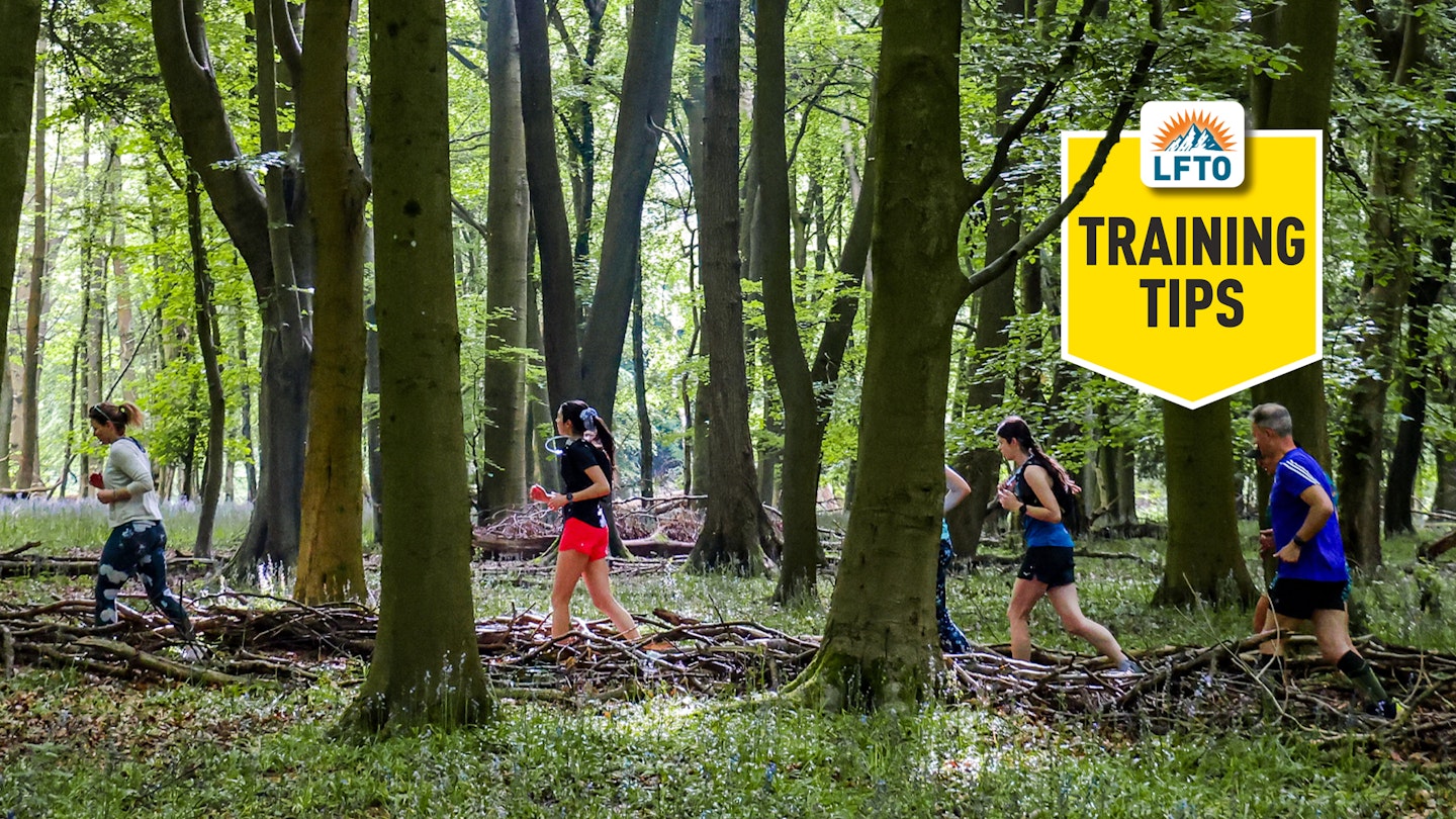 training tips logo on runners in the woods